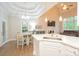 Open concept eat-in kitchen and living room with coffered ceilings and lots of natural light at 260 Ingonish Dr, Gastonia, NC 28056