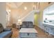 Bright and airy living room with hardwood floors, a staircase, and views to the kitchen at 260 Ingonish Dr, Gastonia, NC 28056