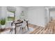 Bright dining room with modern decor, featuring wood floors, natural light, and closet space at 261 8Th Avenue Se Dr, Hickory, NC 28602