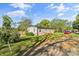 Charming single-story home with lush lawn and mature trees on a sunny day at 261 8Th Avenue Se Dr, Hickory, NC 28602