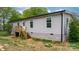 Charming single-story home with light gray siding, white trim, and a welcoming front entrance at 261 8Th Avenue Se Dr, Hickory, NC 28602
