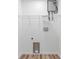 Bright white laundry room with washer and dryer hook ups and shelving at 261 8Th Avenue Se Dr, Hickory, NC 28602