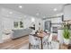 Open-concept living space with modern decor, featuring a dining area, kitchen, and living room at 261 8Th Avenue Se Dr, Hickory, NC 28602