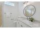 Updated bathroom featuring granite countertops, modern fixtures, vanity and tiled flooring at 3012 Laney Pond Rd, Matthews, NC 28104