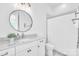 Bright bathroom with granite countertops, vanity, vessel sink, and tiled shower and flooring at 3012 Laney Pond Rd, Matthews, NC 28104