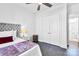 Bedroom featuring double closets, hardwood floors, ceiling fan and neutral decor at 3012 Laney Pond Rd, Matthews, NC 28104