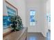 Bright entryway featuring a decorative painting, dark hardwood floors, and a view of the outdoors at 3012 Laney Pond Rd, Matthews, NC 28104