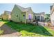 This home has a rear patio with black metal fencing, a covered area and low maintenance yard at 3012 Laney Pond Rd, Matthews, NC 28104