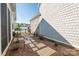 Side yard with a stone pathway, mulched garden beds, and gated access to the backyard at 3012 Laney Pond Rd, Matthews, NC 28104