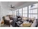 Relaxing sunroom with comfortable seating, ceiling fan, and plenty of natural light at 3012 Laney Pond Rd, Matthews, NC 28104