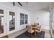 Cozy sunroom with a round table, seating for four, and lots of natural light at 3012 Laney Pond Rd, Matthews, NC 28104