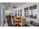 Inviting sunroom features dining and sitting area, lots of natural light, and coffered ceiling with fan at 3012 Laney Pond Rd, Matthews, NC 28104