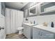 The bathroom has a double vanity, mirrors, and a tiled shower and floor at 3131 Arborhill Rd, Charlotte, NC 28270