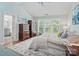 Bedroom with an ensuite bathroom featuring an accent rug and ample natural light at 3131 Arborhill Rd, Charlotte, NC 28270