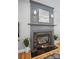 Elegant fireplace with dark mantel, stylish decor, and tiled hearth at 3131 Arborhill Rd, Charlotte, NC 28270
