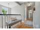 Light-filled hallway with bench, wood floors, a stylish rug and a decorative mirror at 3131 Arborhill Rd, Charlotte, NC 28270
