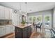 Kitchen island with granite countertops and stainless steel appliances, close to both dining and living spaces at 3131 Arborhill Rd, Charlotte, NC 28270