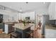Lovely kitchen with stainless steel appliances, granite island with seating, and an open floor plan at 3131 Arborhill Rd, Charlotte, NC 28270