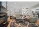 Spacious living room with fireplace, hardwood floors, and access to the kitchen at 3131 Arborhill Rd, Charlotte, NC 28270