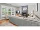 Cozy living room with fireplace, large windows, and plush seating at 3131 Arborhill Rd, Charlotte, NC 28270