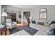 Open living area featuring elegant columns, hardwood floors, and comfortable seating at 3131 Arborhill Rd, Charlotte, NC 28270