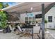 Outdoor covered patio featuring a comfortable seating area, plants and a ceiling fan at 3131 Arborhill Rd, Charlotte, NC 28270