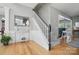 Stairway with hardwood floors, white trim, and contemporary decor at 3131 Arborhill Rd, Charlotte, NC 28270