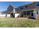 View of the backyard with a screen porch and a white fence at 3246 Yarmouth Ln, Gastonia, NC 28056