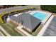 Aerial view of the brick clubhouse showcases the adjacent community pool at 3246 Yarmouth Ln, Gastonia, NC 28056