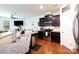 Open-concept kitchen with granite countertops, stainless steel appliances, and a view into the living area at 3246 Yarmouth Ln, Gastonia, NC 28056