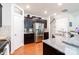 Modern kitchen featuring granite countertops, stainless steel appliances, and dark cabinetry at 3246 Yarmouth Ln, Gastonia, NC 28056