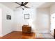 Living room featuring hardwood floors, a decorative cabinet, and natural light at 3246 Yarmouth Ln, Gastonia, NC 28056
