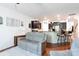 Open-concept living space with a modern kitchen, cozy seating, and hardwood floors at 3246 Yarmouth Ln, Gastonia, NC 28056