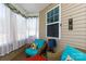Cozy sunroom with wicker furniture, bright cushions, and sheer curtains for a relaxing atmosphere at 3246 Yarmouth Ln, Gastonia, NC 28056