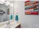 Bathroom with a modern vanity and decorative wall art at 3335 Hawick Commons Dr, Concord, NC 28027