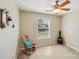 Bedroom offers neutral paint, ceiling fan, and a large window at 3335 Hawick Commons Dr, Concord, NC 28027