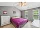 Bedroom features a vaulted ceiling, large windows, and light gray walls at 3335 Hawick Commons Dr, Concord, NC 28027
