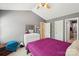 A bedroom offering natural light, a walk in closet, and neutral colored carpet at 3335 Hawick Commons Dr, Concord, NC 28027