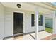 Charming covered porch and black front door welcome you home at 3335 Hawick Commons Dr, Concord, NC 28027