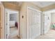 Bright hallway with carpet, double closet, and a view into the bedroom at 3335 Hawick Commons Dr, Concord, NC 28027