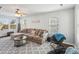 Spacious living room with a comfortable sectional sofa and ceiling fan at 3335 Hawick Commons Dr, Concord, NC 28027