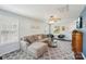 Bright living room with a comfortable sectional sofa and ceiling fan at 3335 Hawick Commons Dr, Concord, NC 28027