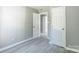 A view of the bedroom shows hard surface flooring, and doors to closets or ensuites at 340 Whitner St, Rock Hill, SC 29730