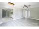 Open living area featuring modern flooring that flows into the kitchen with white cabinets at 340 Whitner St, Rock Hill, SC 29730