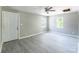 Open concept living area with gray walls, modern floors, ceiling fan, and front door at 340 Whitner St, Rock Hill, SC 29730
