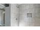 The renovated shower features tile surround and recessed shelf at 340 Whitner St, Rock Hill, SC 29730