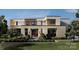 Modern home featuring a dramatic courtyard entry and contemporary stucco, siding, and black trim window design at 3630 Foxcroft Rd, Charlotte, NC 28211