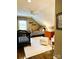 Bright bedroom with a crib, bed and orange dresser at 3718 Barclay Downs Dr, Charlotte, NC 28209