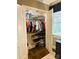 A well-organized walk-in closet, offering ample storage space and shelves at 3718 Barclay Downs Dr, Charlotte, NC 28209