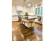 Bright kitchen with a large island, stainless steel appliances, and ample natural light at 3718 Barclay Downs Dr, Charlotte, NC 28209